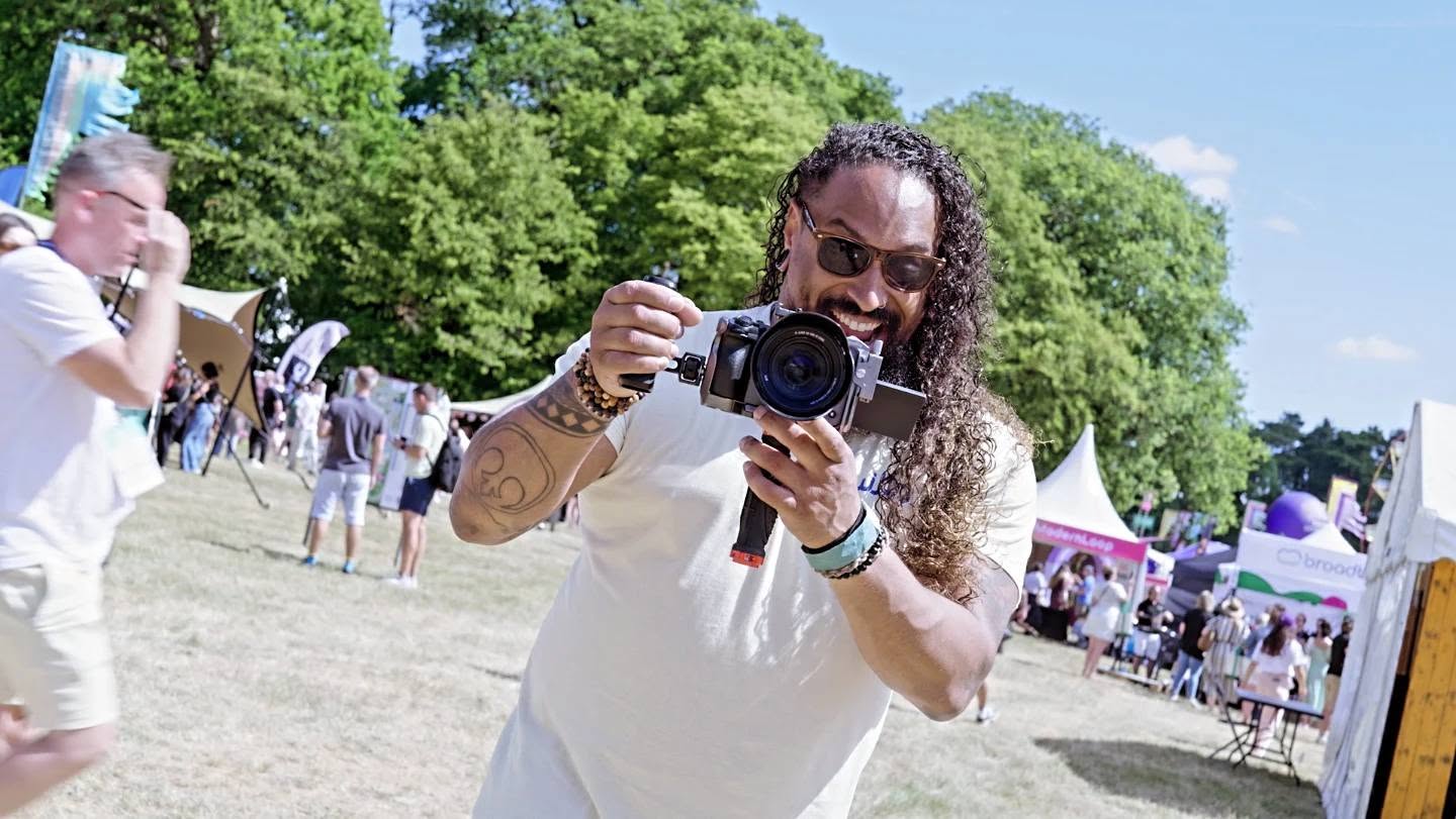 Troy filming at an outdoor event